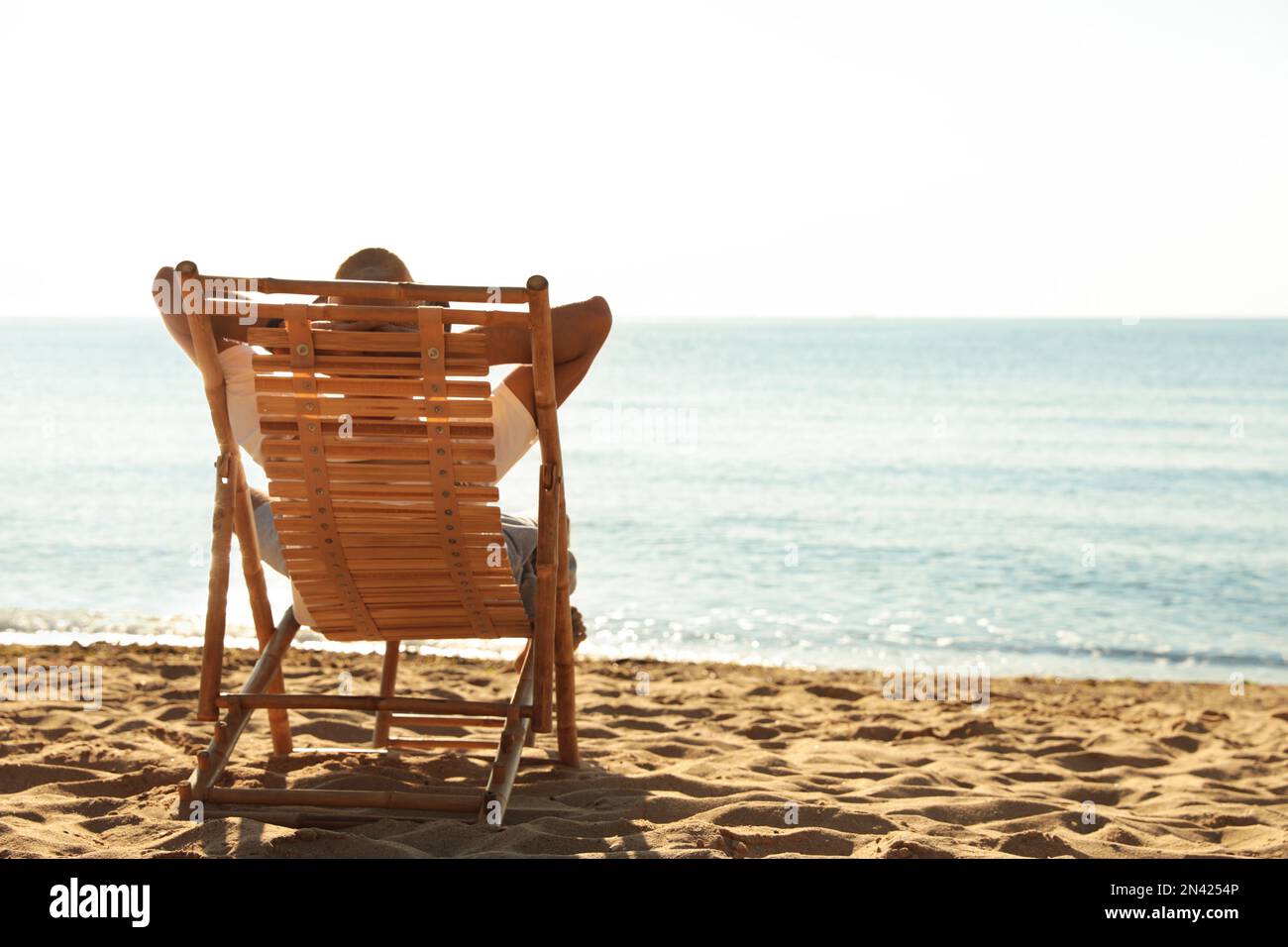 Man beach chair back hi-res stock photography and images - Alamy