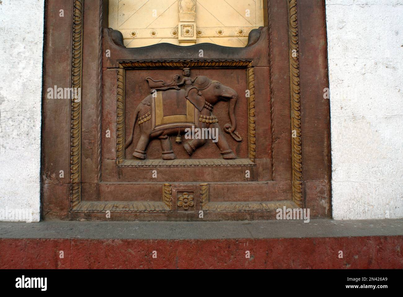 Carved elephant carring ambari in red stone at Ujjain city of Madhya Pradesh India Stock Photo