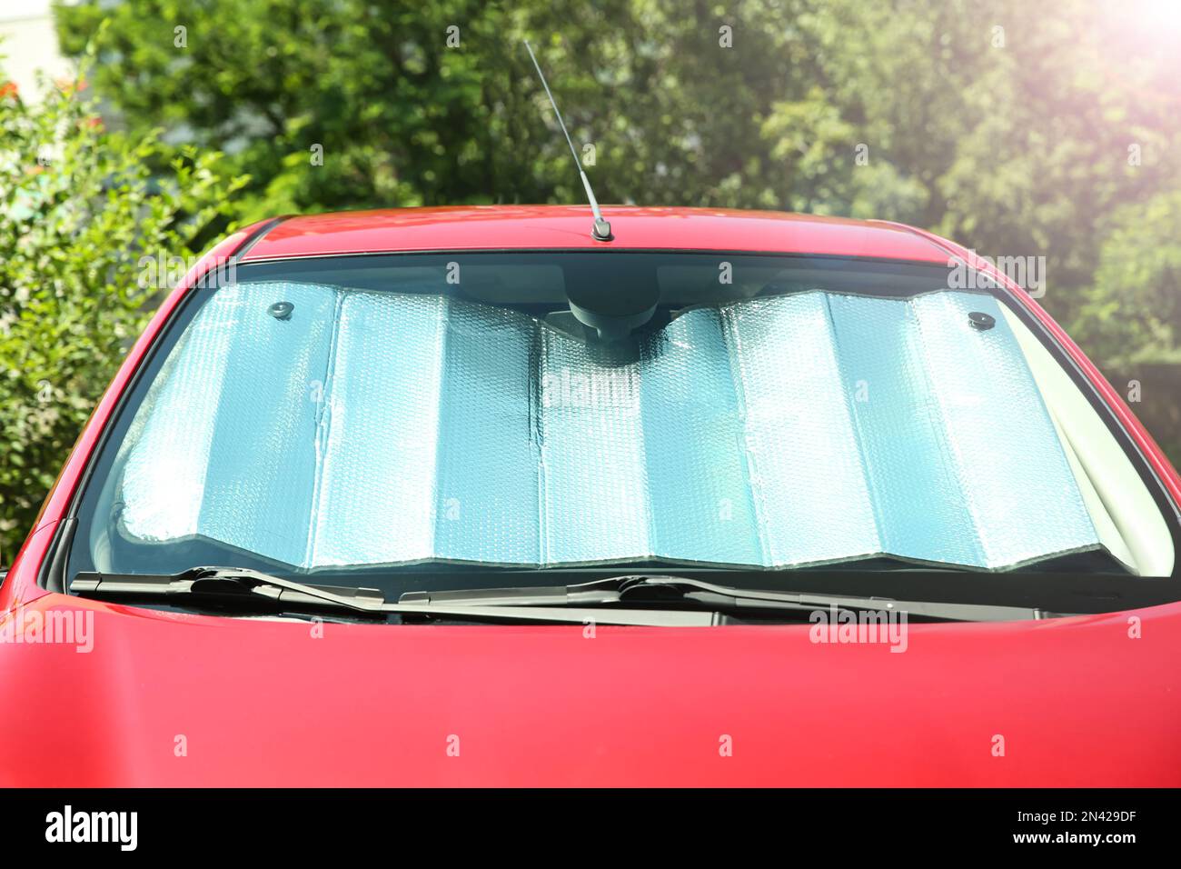 Sun shade under windshield in car, closeup. Heat protection Stock Photo