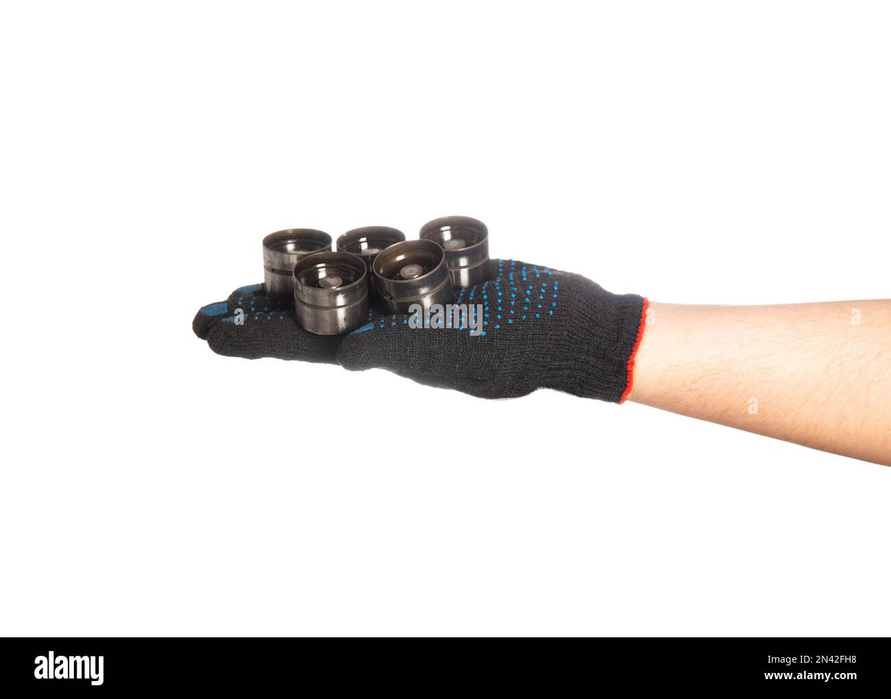 Hydraulic lifters in the hand of a car mechanic minder on a white