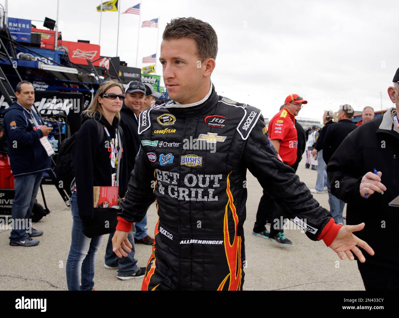 NASCAR driver AJ Allmendinger (47) walks to his garage during a ...