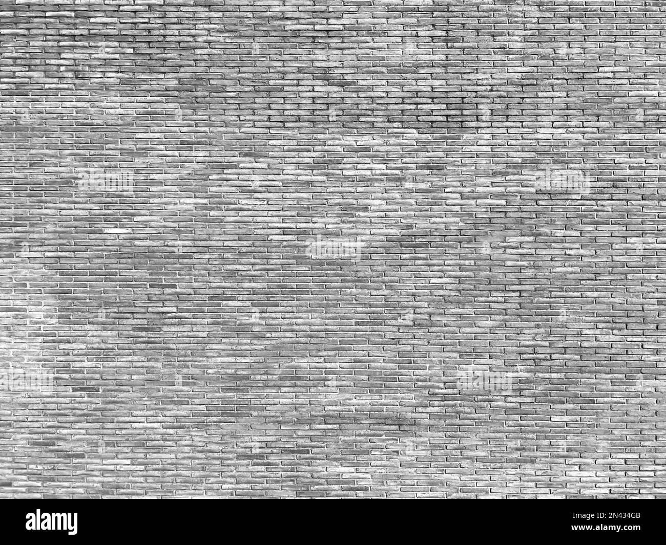 Wall with exposed solid ceramic brick aged by time. solid brick large scale texture. Stock Photo