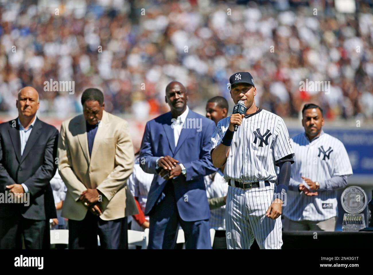 Hall of Fame outfielder Dave Winfield, left, presents New York Yankees  shortstop Derek Jeter with a gift from the old Yankee Stadium as Jeter was  honored for breaking Lou Gehrig's Yankee record