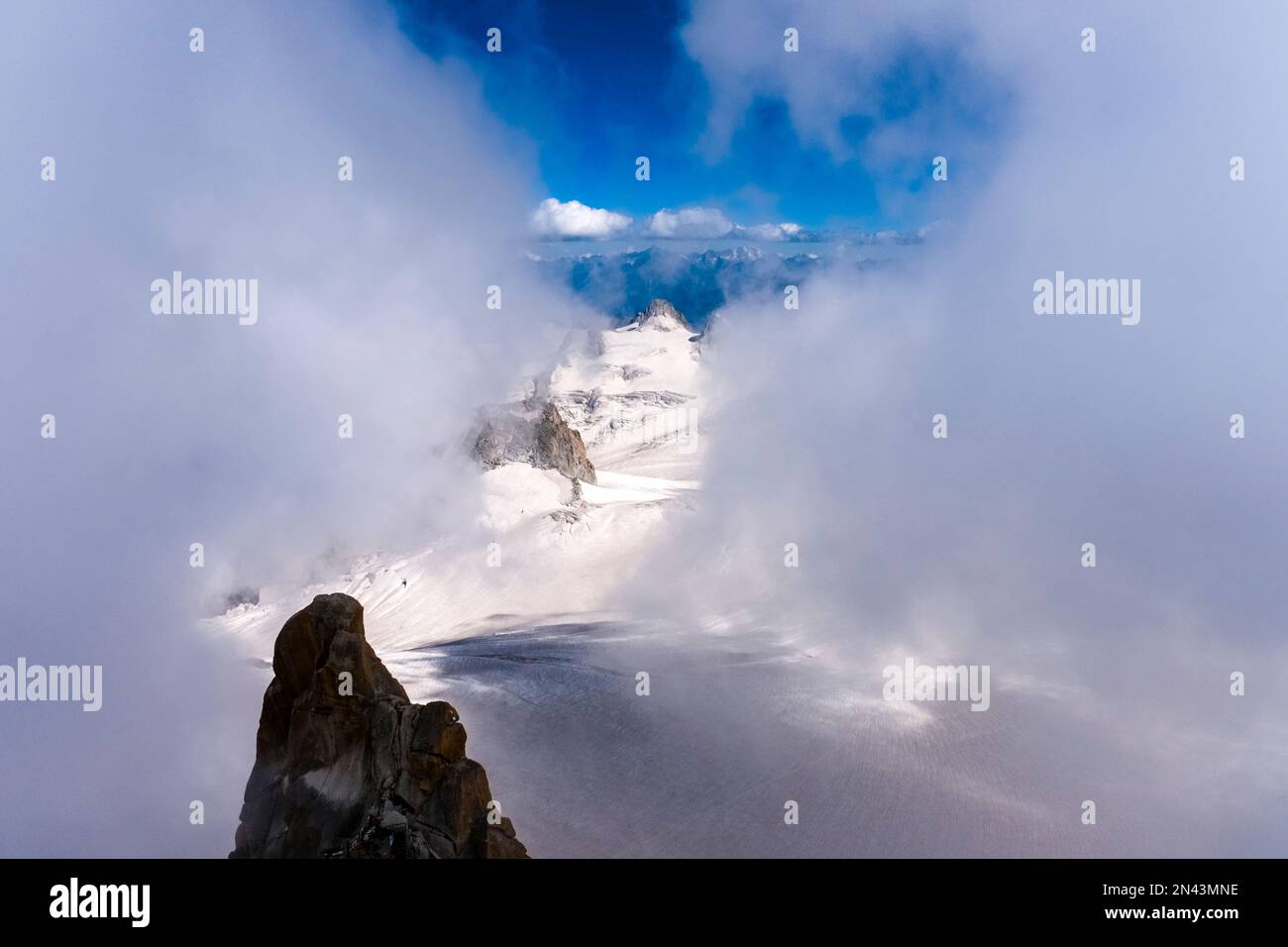 View from Aiguille du Midi of the Géant Glacier, clouds moving in ...