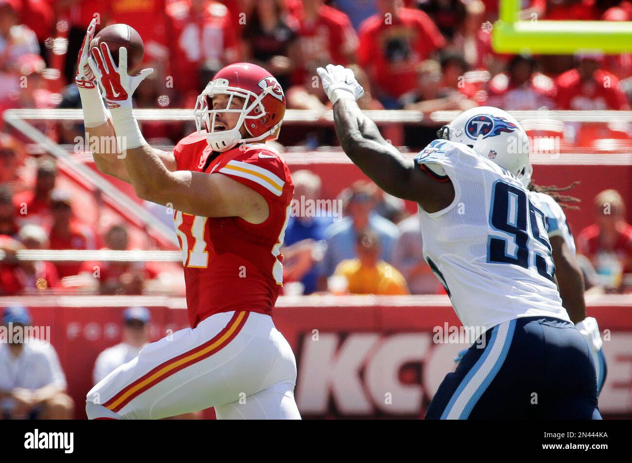 Kansas City Chiefs tight end Travis Kelce, left, catches a pass in