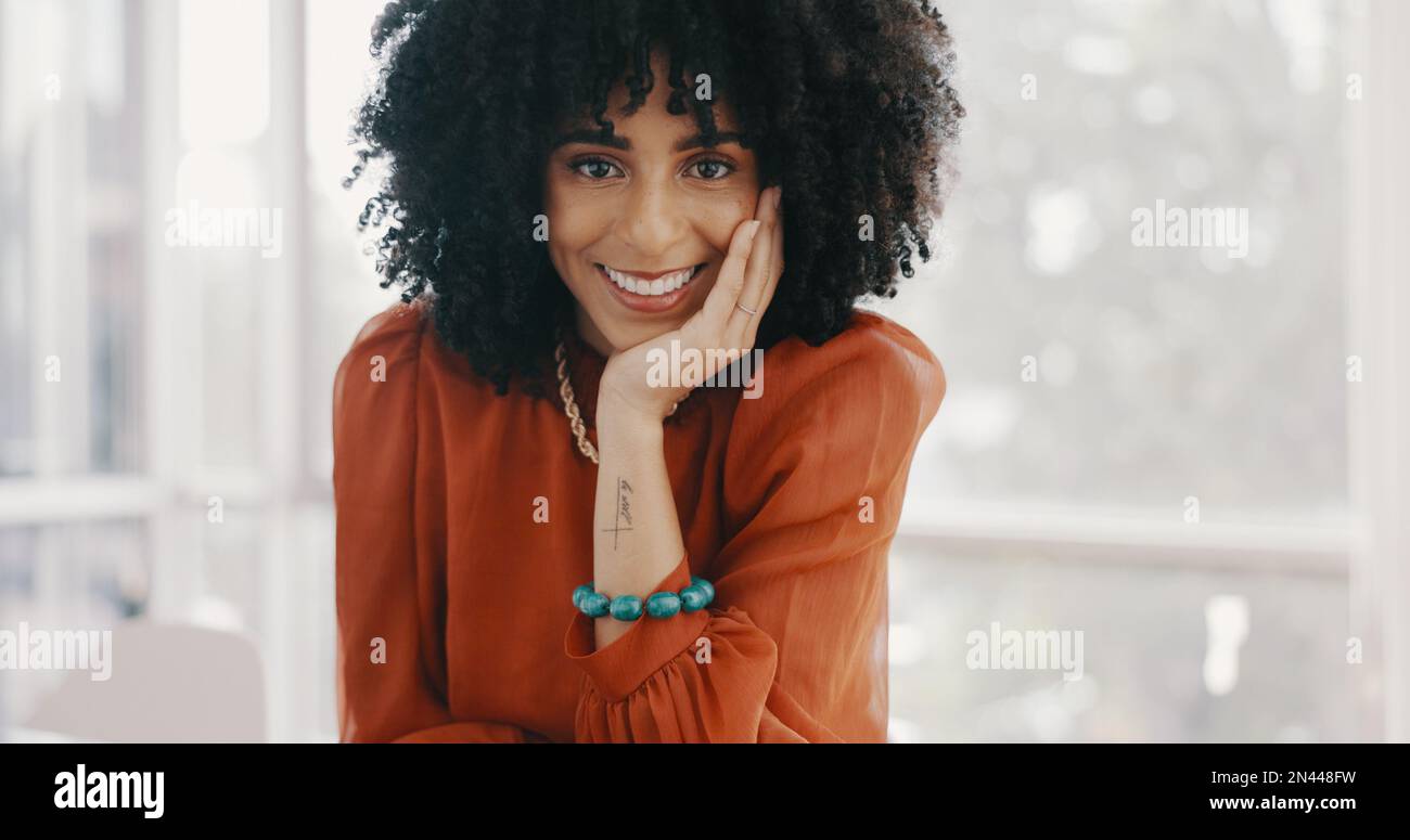 Face, vision and mindset with a business black woman sitting at a desk ...