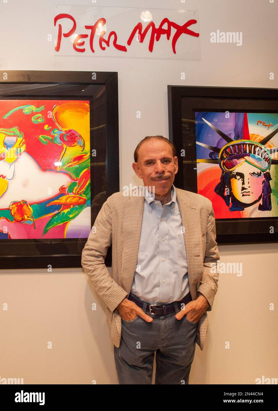 Artist Peter Max poses for a photo during his retrospective with the Artist Peter Max poses for a photo during his retrospective with the