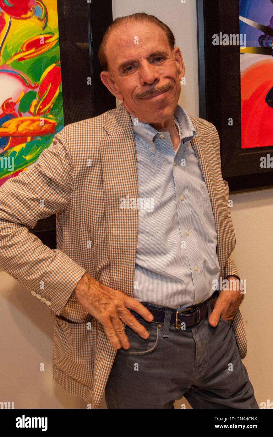 Artist Peter Max during his retrospective with the Road Show Company Artist Peter Max during his retrospective with the Road Show Company