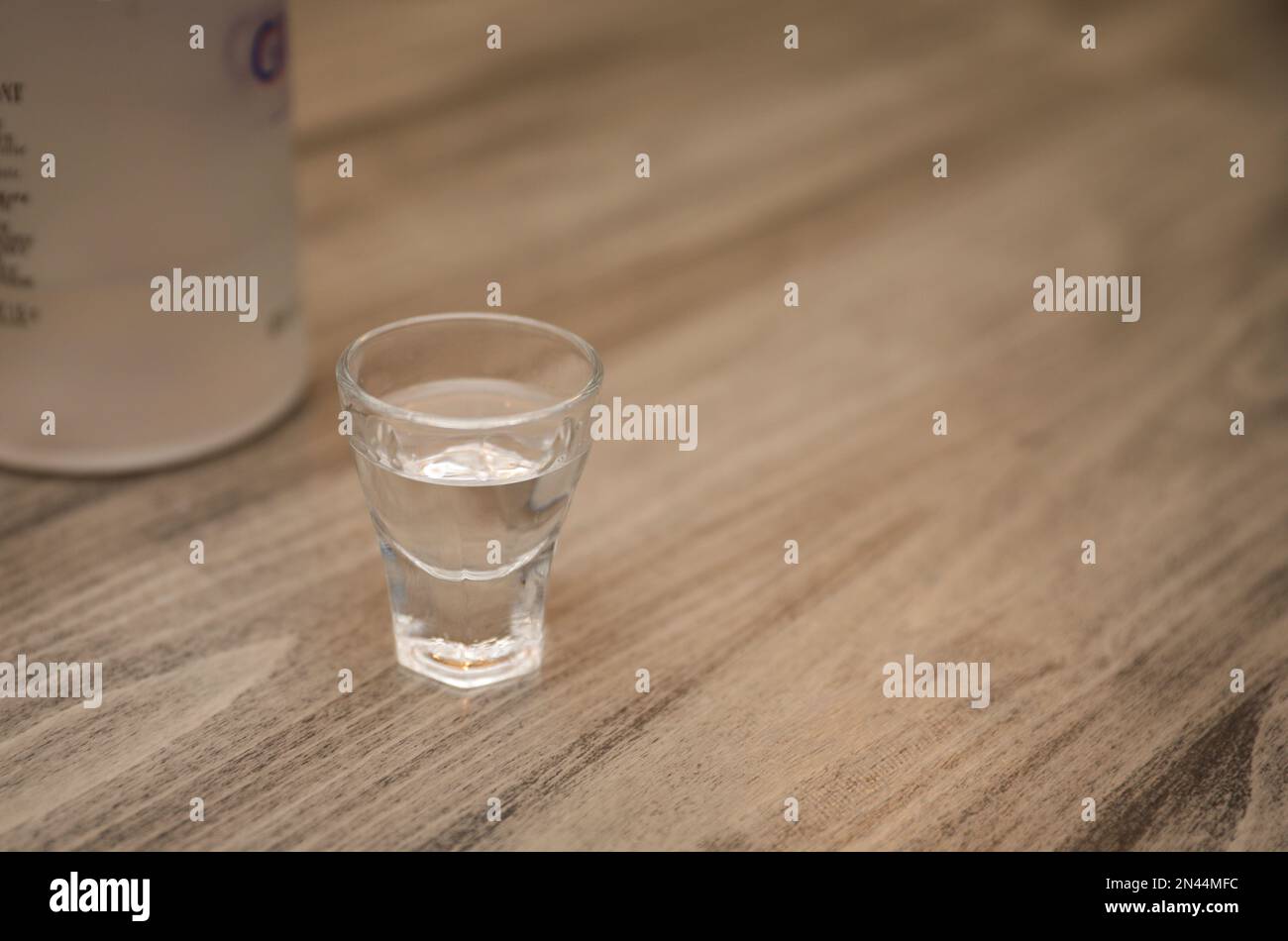 Making alcohol drink with shot glass in cup Stock Photo Alamy