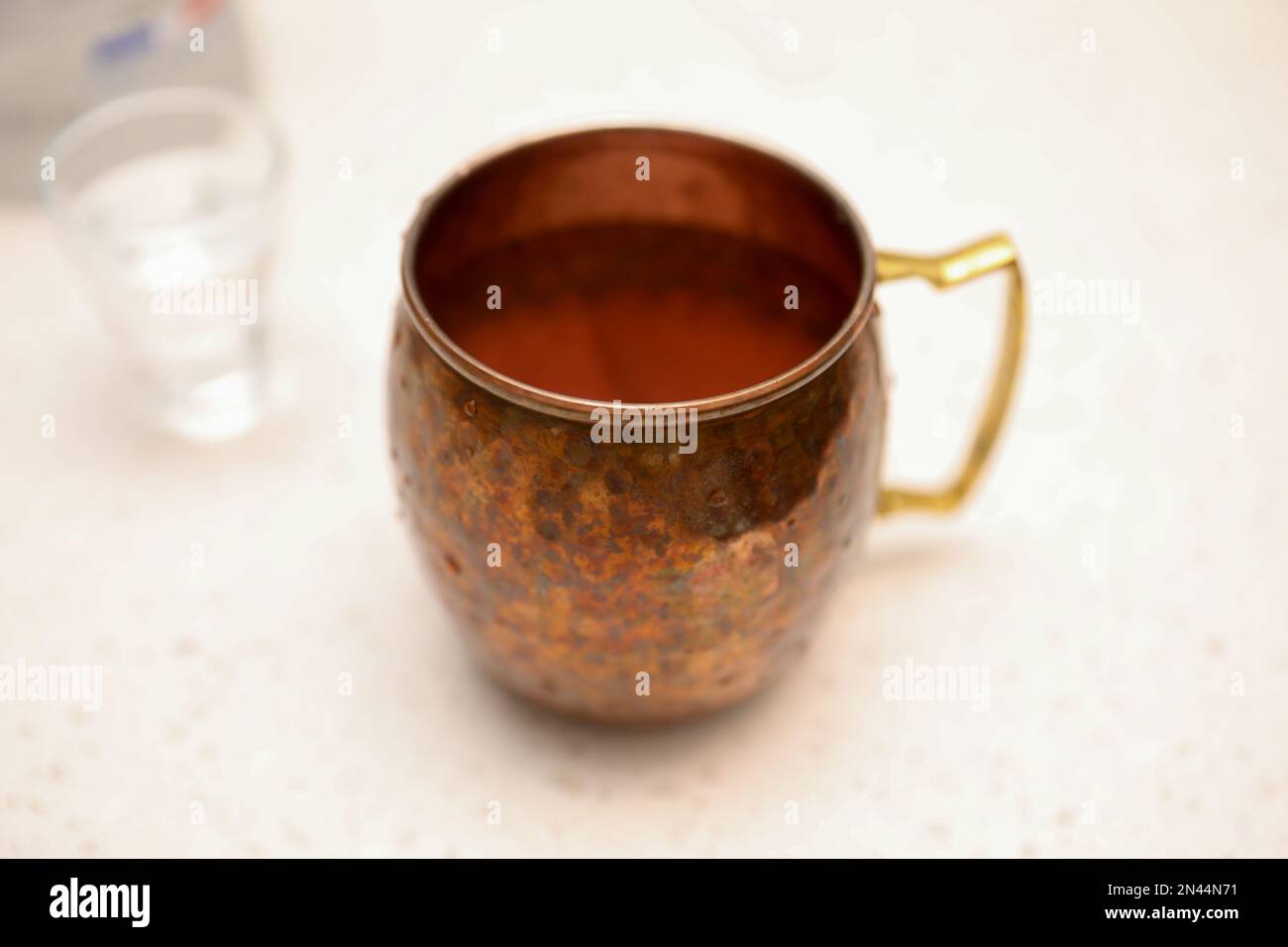Making alcohol drink with shot glass in cup Stock Photo Alamy