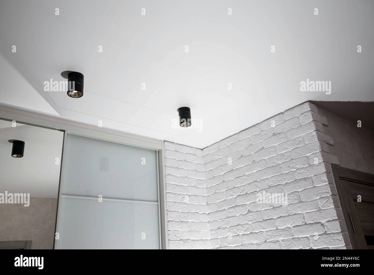 Beautiful black LED lights on the ceiling. Modern stretch ceiling