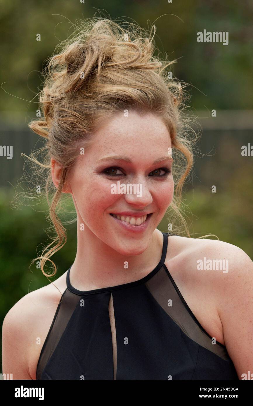 actress-charlotte-spencer-poses-for-photographers-as-she-arrives-for