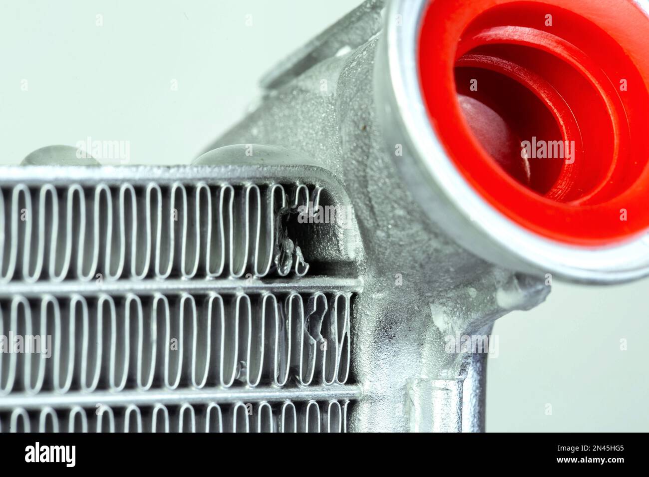 damaged on a car radiator, closeup. Broken radiator Stock