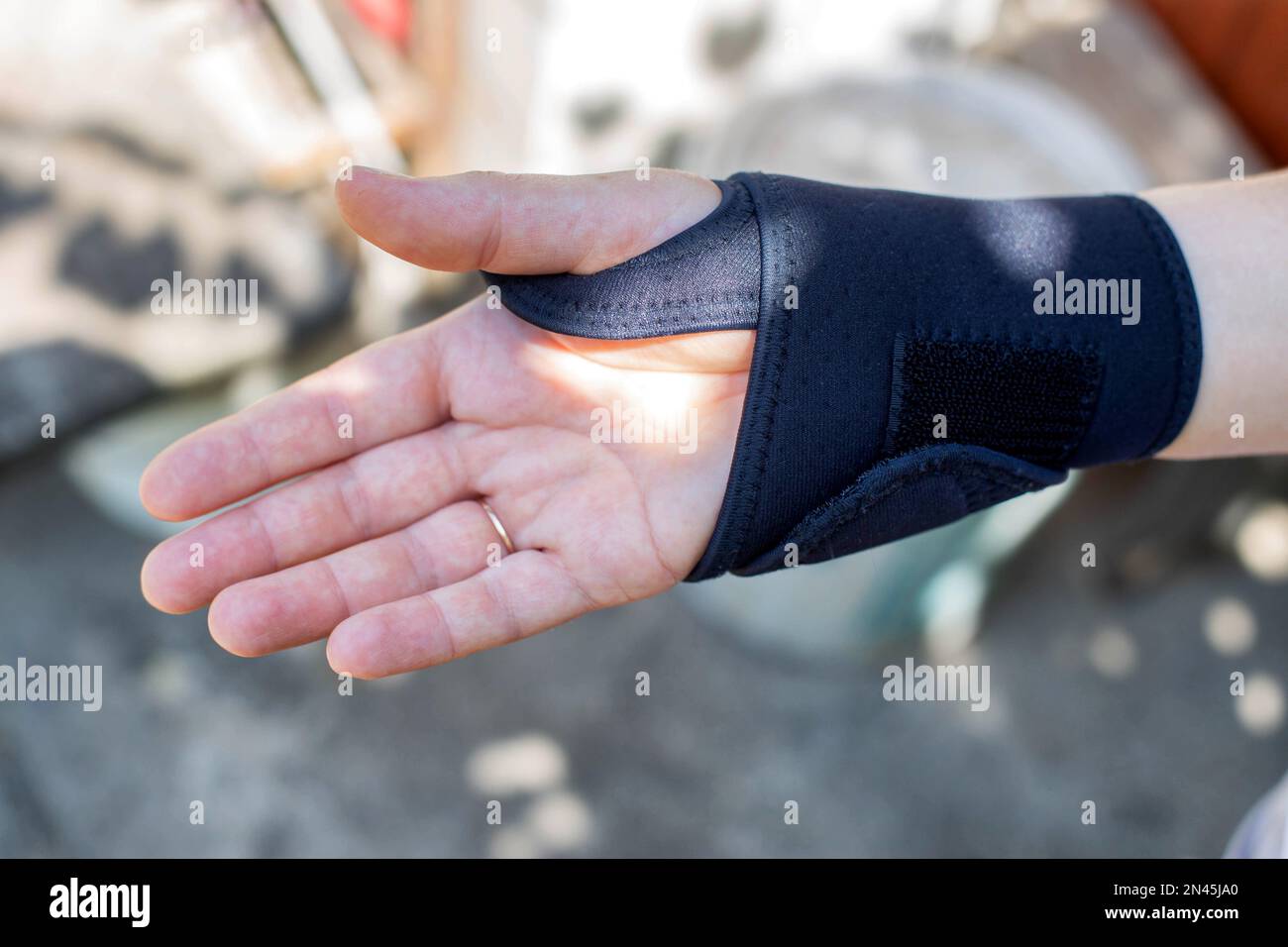 Universal fixator of the wrist joint on the patient's hand. Bandage for