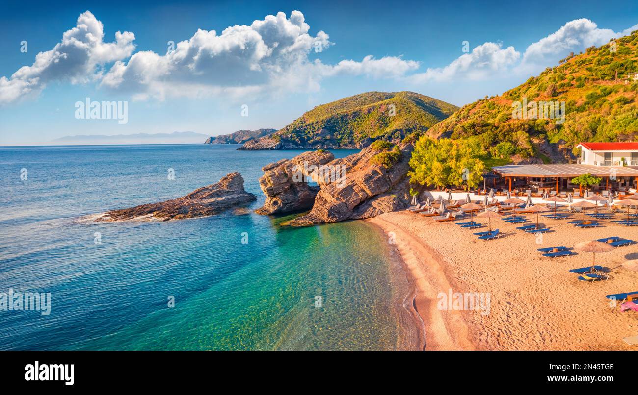 Spectacular morning view of Kama beach in Kalamos village. Sunny outdoor scene of Euboea island, Greece, Europe. Calm summer seascape of Aegean sea. Stock Photo