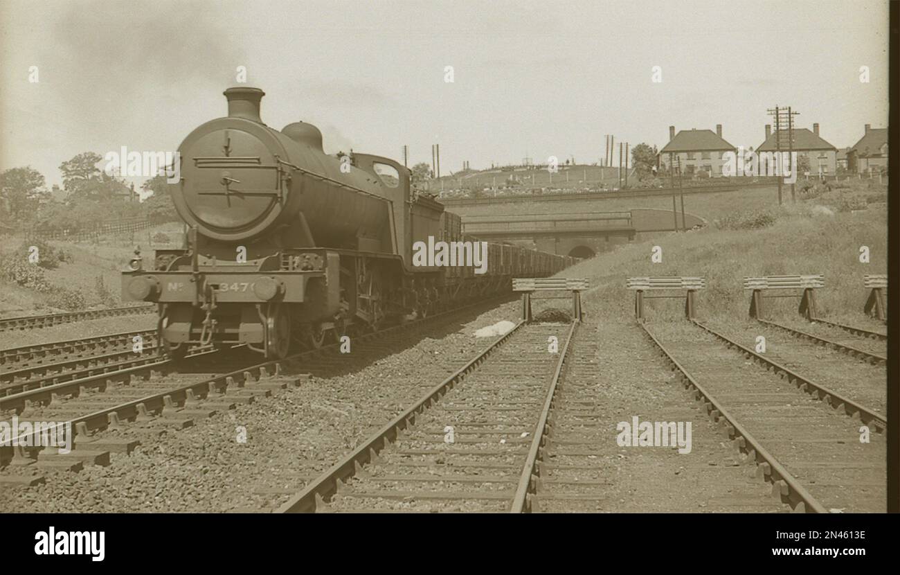 Former Great Northern Railway 2-8-0 steam locomotive as LNER O3 Class No.3470 emerges from Wood Green tunnels with a goods train in the summer of 1939 Stock Photo