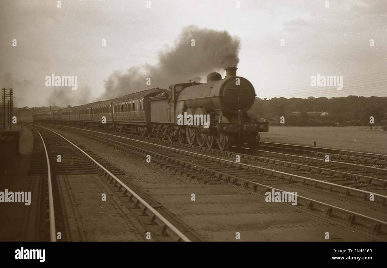Former Great Northern Railway 4-4-2 Atlantic steam locomotive as LNER C2 on an express train in the late 1930s Stock Photo