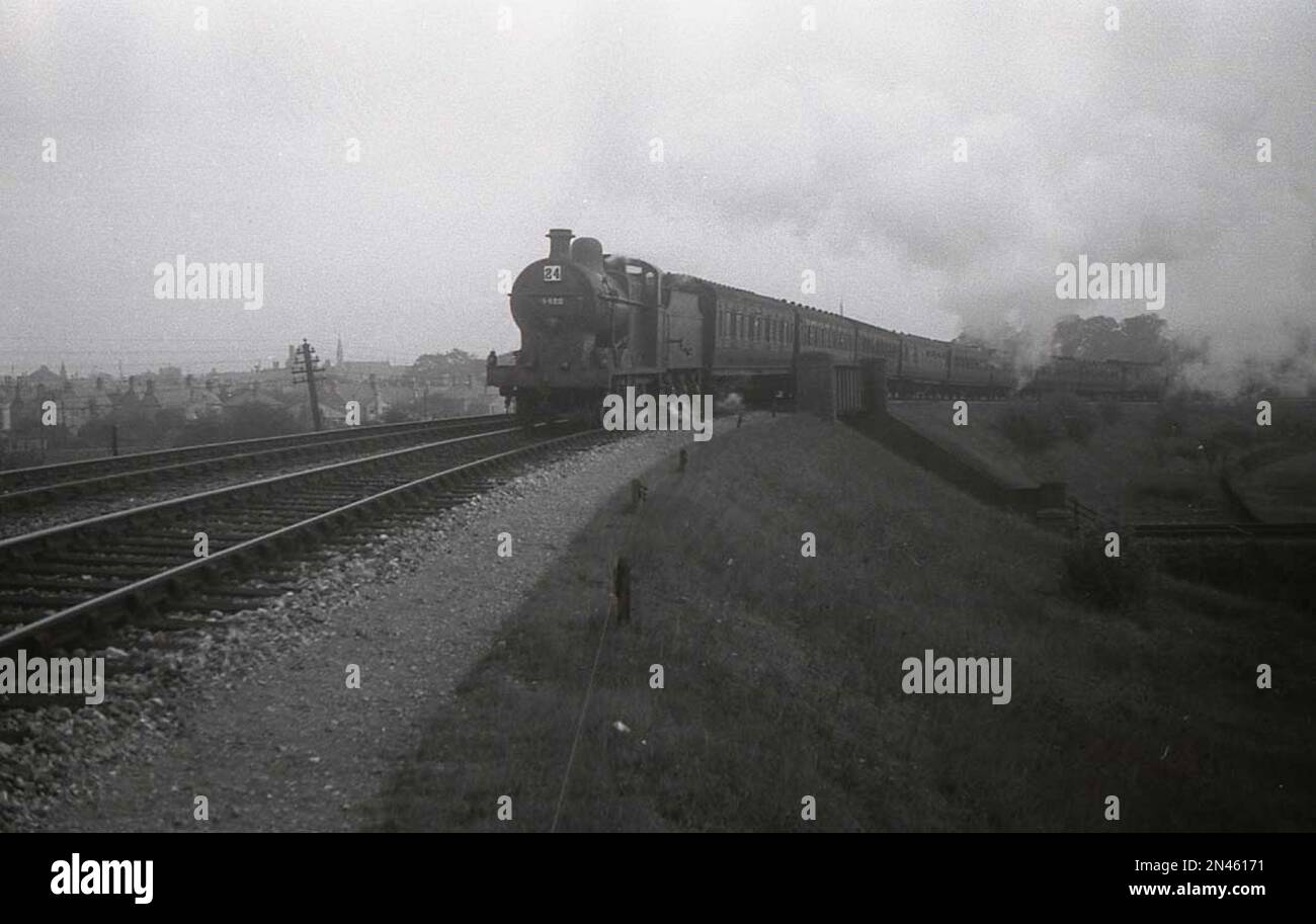 An LMS 4F 0-6-0 steam locomotive with automatic tablet catcher extended on the M&GNR line in the 1930s Stock Photo