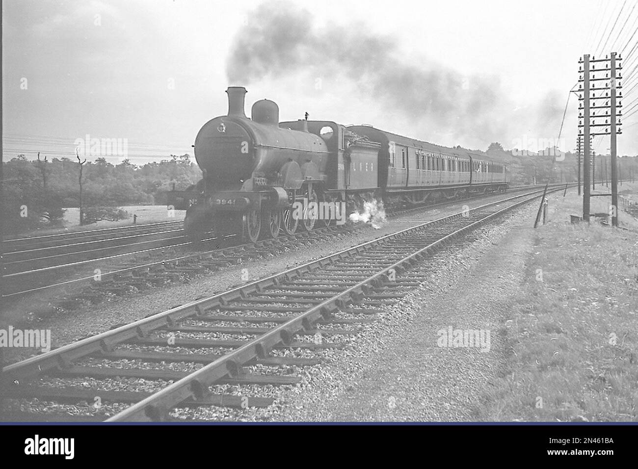 Former Great Northern Railway 4-4-2 Atlantic  No.949 as LNER Class C2 No.3949 on a passenger train in the 1930s Stock Photo
