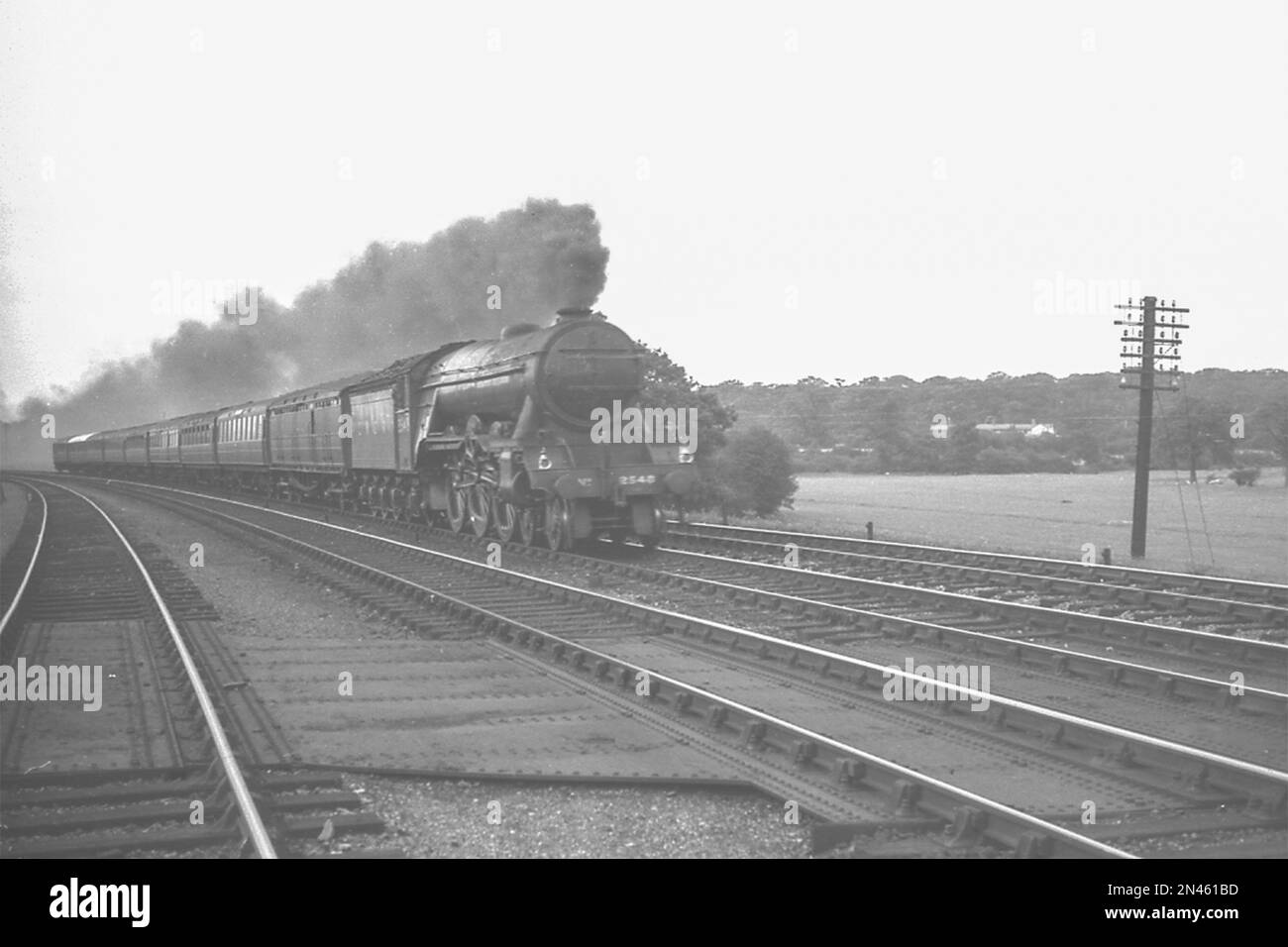 LNER built A3 Pacific 4-6-2 No.2543 'Melton' on an express in the 1930s Stock Photo