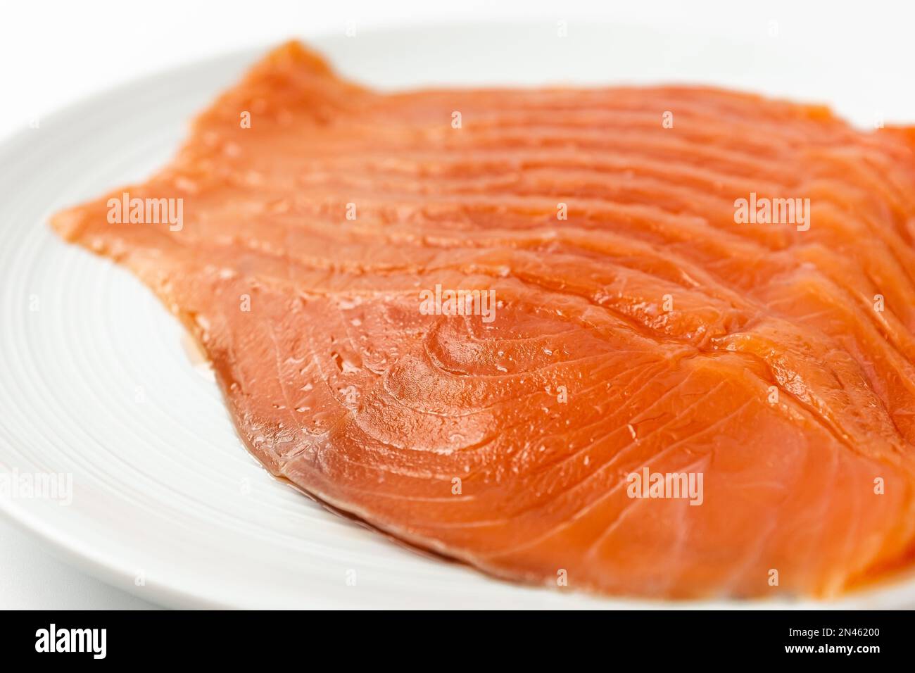 smoked fish. food made with salmon. Sliced Smoked Salmon Stock Photo