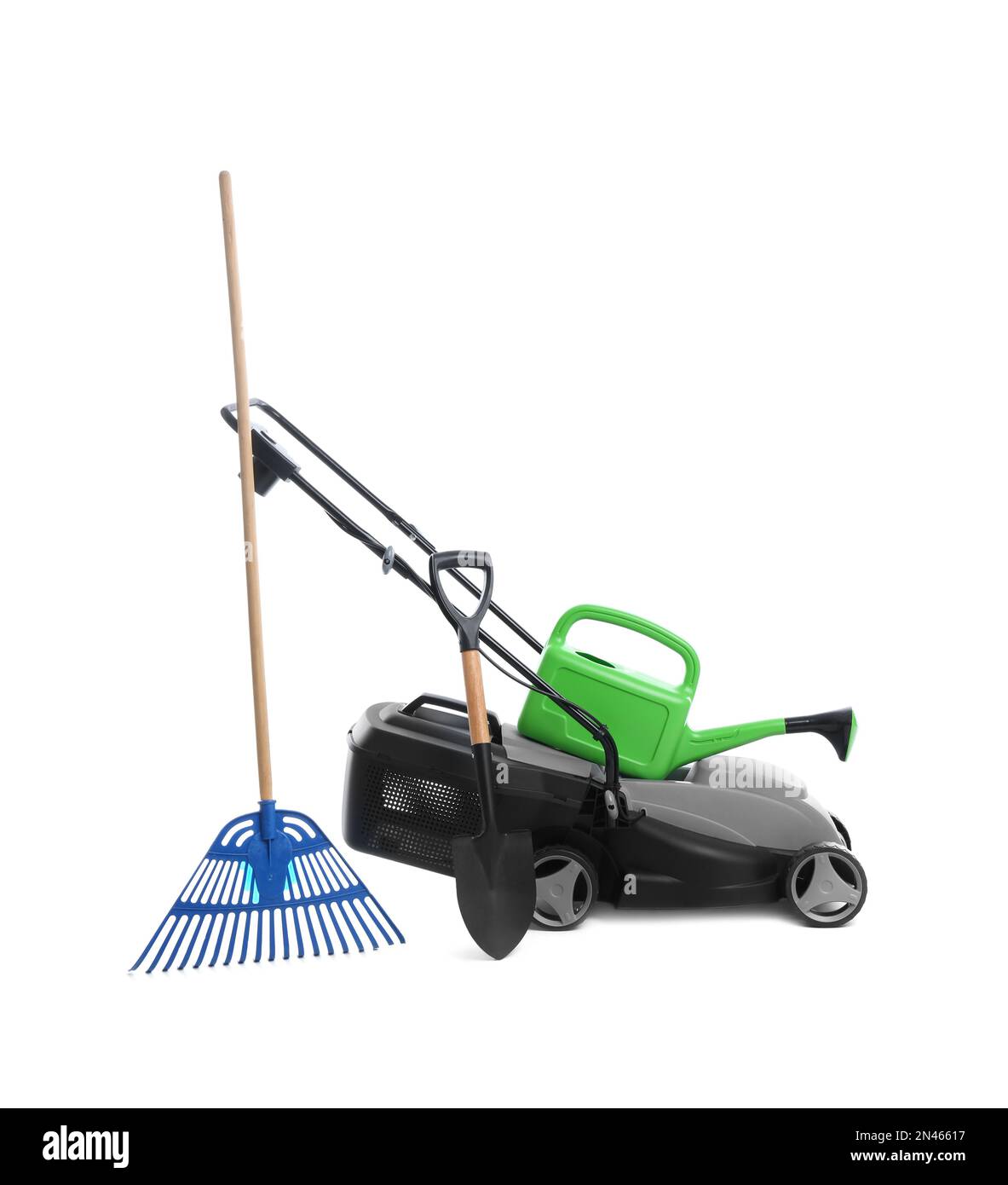 Modern electric grass cutter and gardening tools on white background