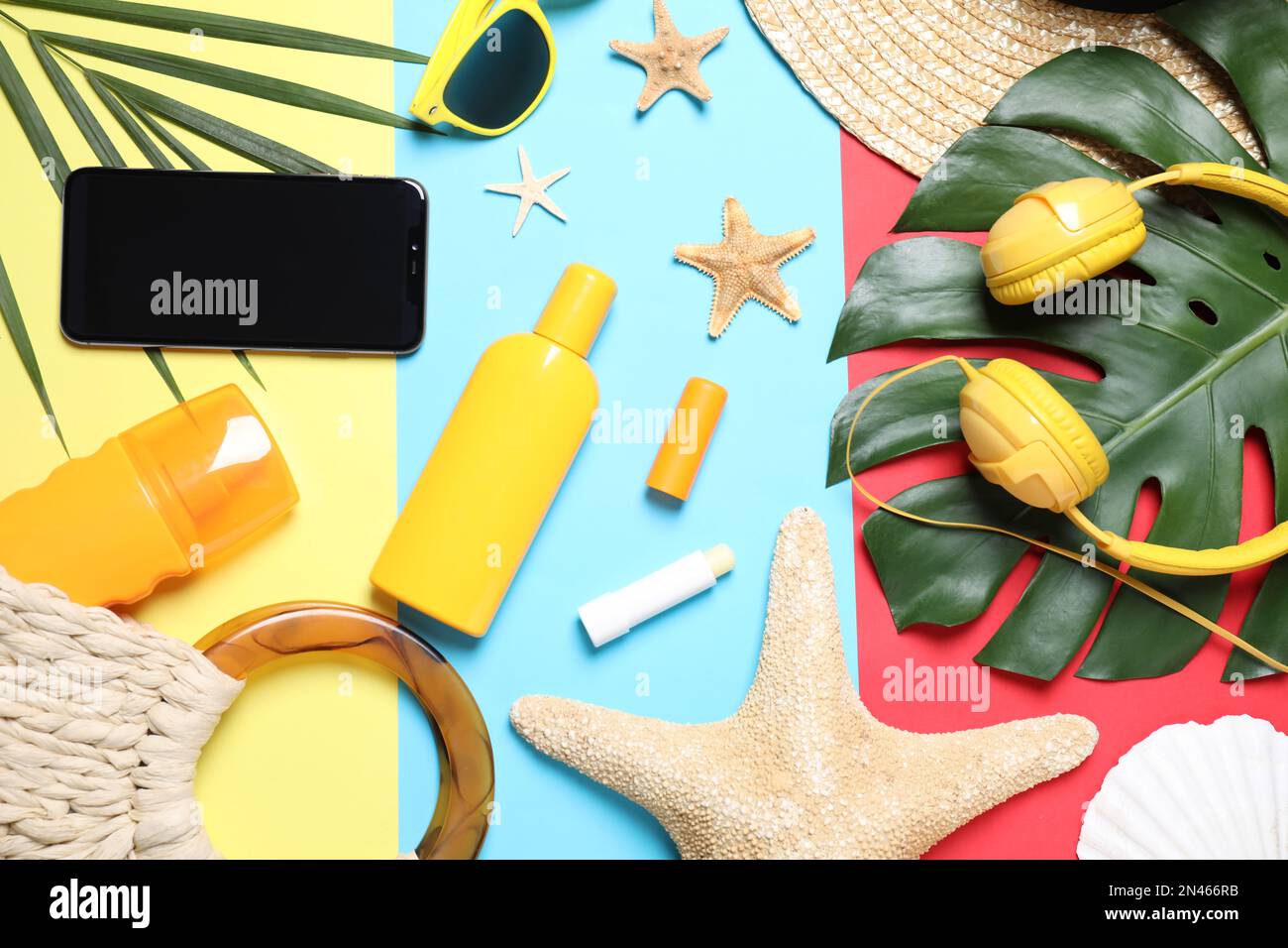 Flat lay composition with beach objects and smartphone on color background Stock Photo