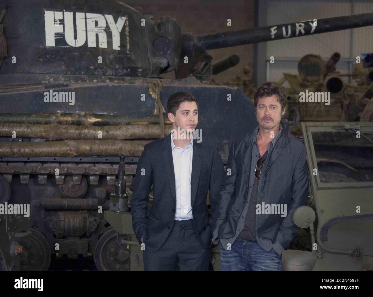 US actors Brad Pitt, right, and Logan Lerman pose for photographs