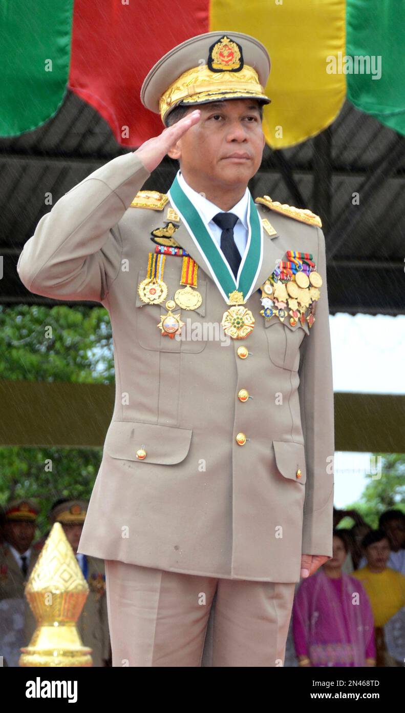 Senior General Min Aung Hlaing of Myanmar Armed Forces salutes female army  officers of the first batch during the graduation ceremony at Myanmar  Army's Training School in Hmawbi, suburb of Yangon, Myanmar,