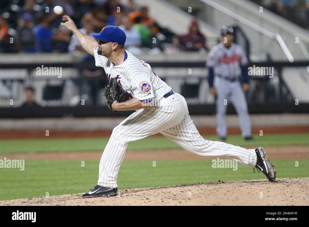 New York Mets relief pitcher Buddy Carlyle throws in the eighth inning of a baseball game