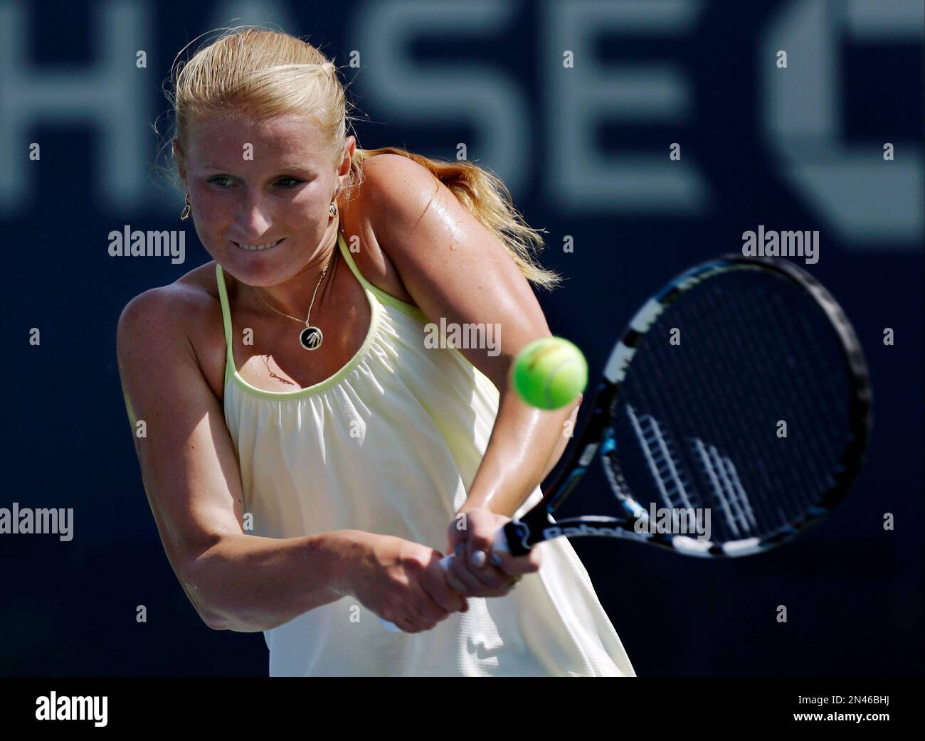 Alla Kudryavtseva, of Russia, returns a shot against Angelique Kerber, of  Germany, during the second round of the 2014 U.S. Open tennis tournament,  Wednesday, Aug. 27, 2014, in New York. (AP Photo/Frank