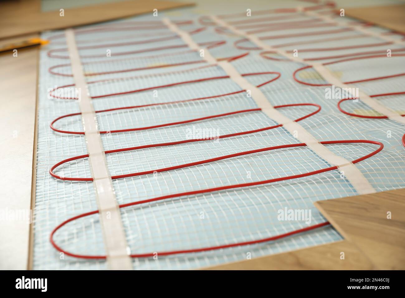 Installation of electric underfloor heating system indoors, closeup