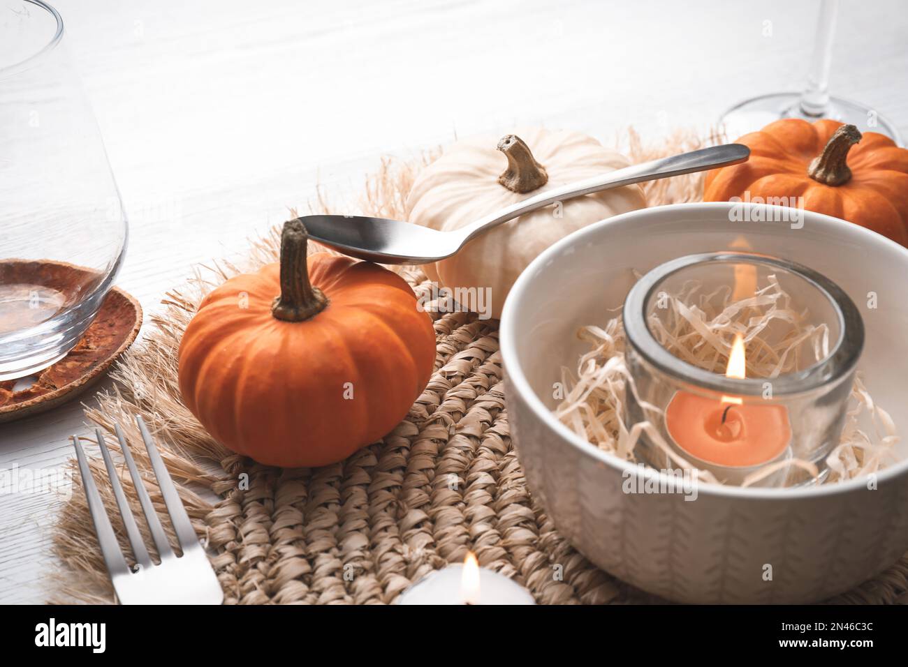 Autumn table setting with pumpkins on white background Stock Photo - Alamy