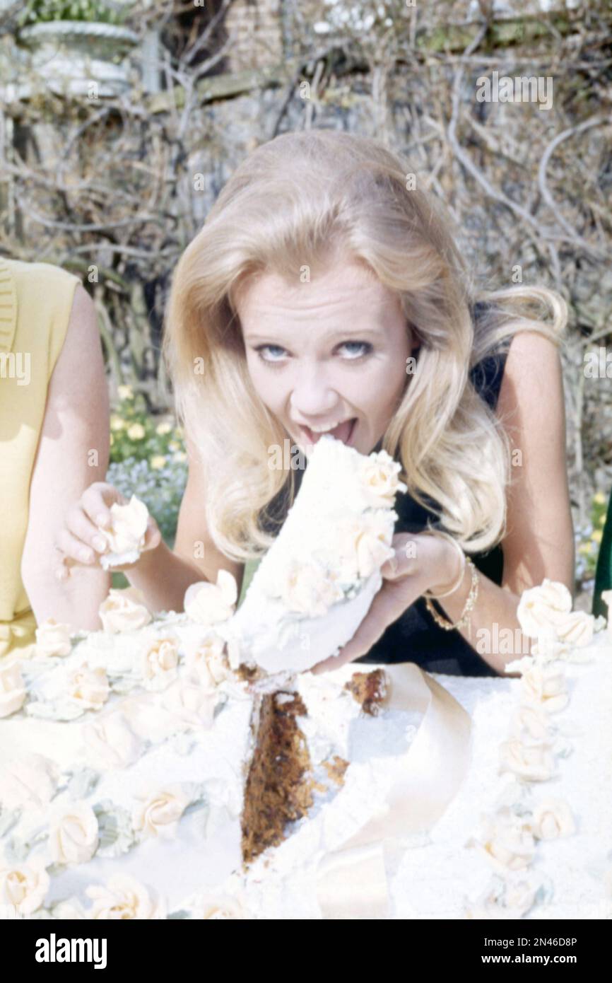 British actress Hayley Mills eating cake on her 21st birthday on April