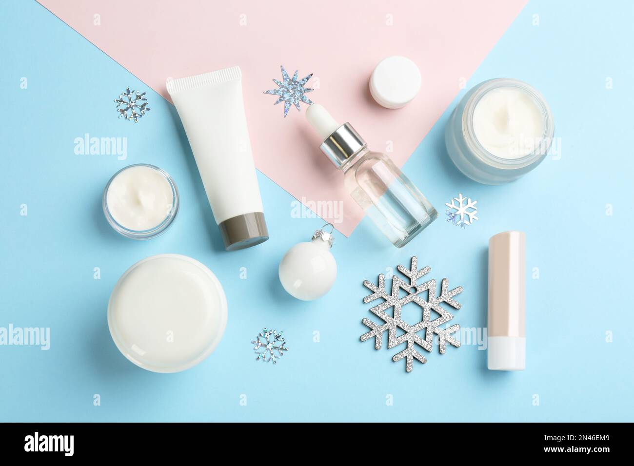 Flat lay composition with different cosmetic products on color ...