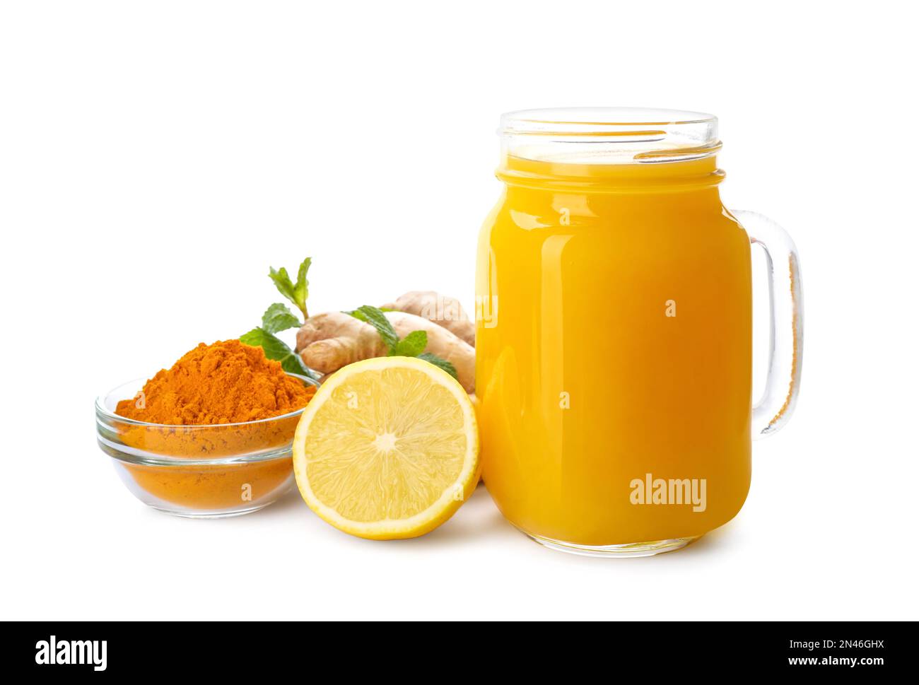 Immunity boosting drink with lemon, ginger and turmeric on white