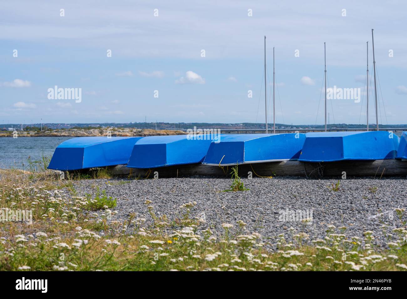 A line of turned boats at the shore Stock Photo - Alamy