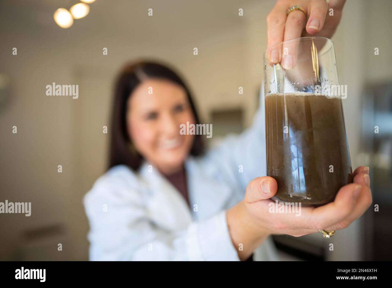 Soil test, female agricultural scientist conducting a soil test in a