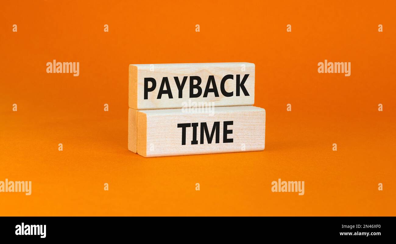 Payback time symbol. Concept words Payback time on wooden blocks