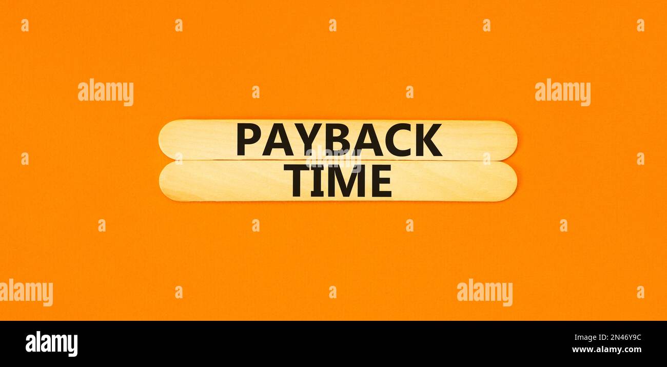 Payback time symbol. Concept words Payback time on wooden stick