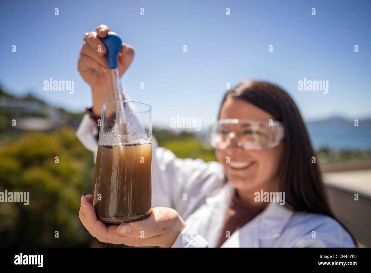 Soil test, female agricultural scientist conducting a soil test in a