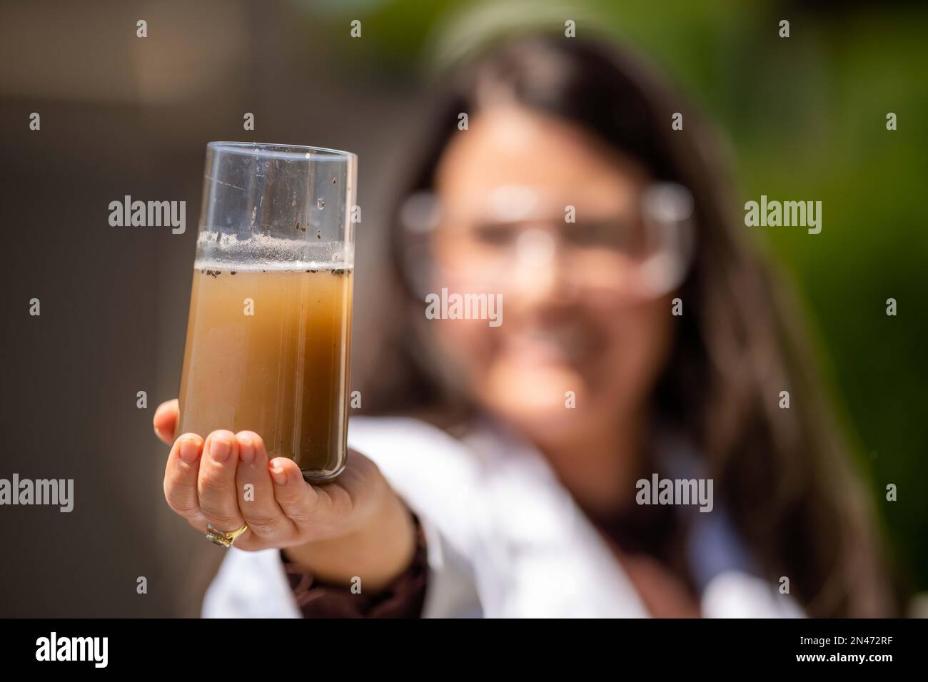 Soil test, female agricultural scientist conducting a soil test in a