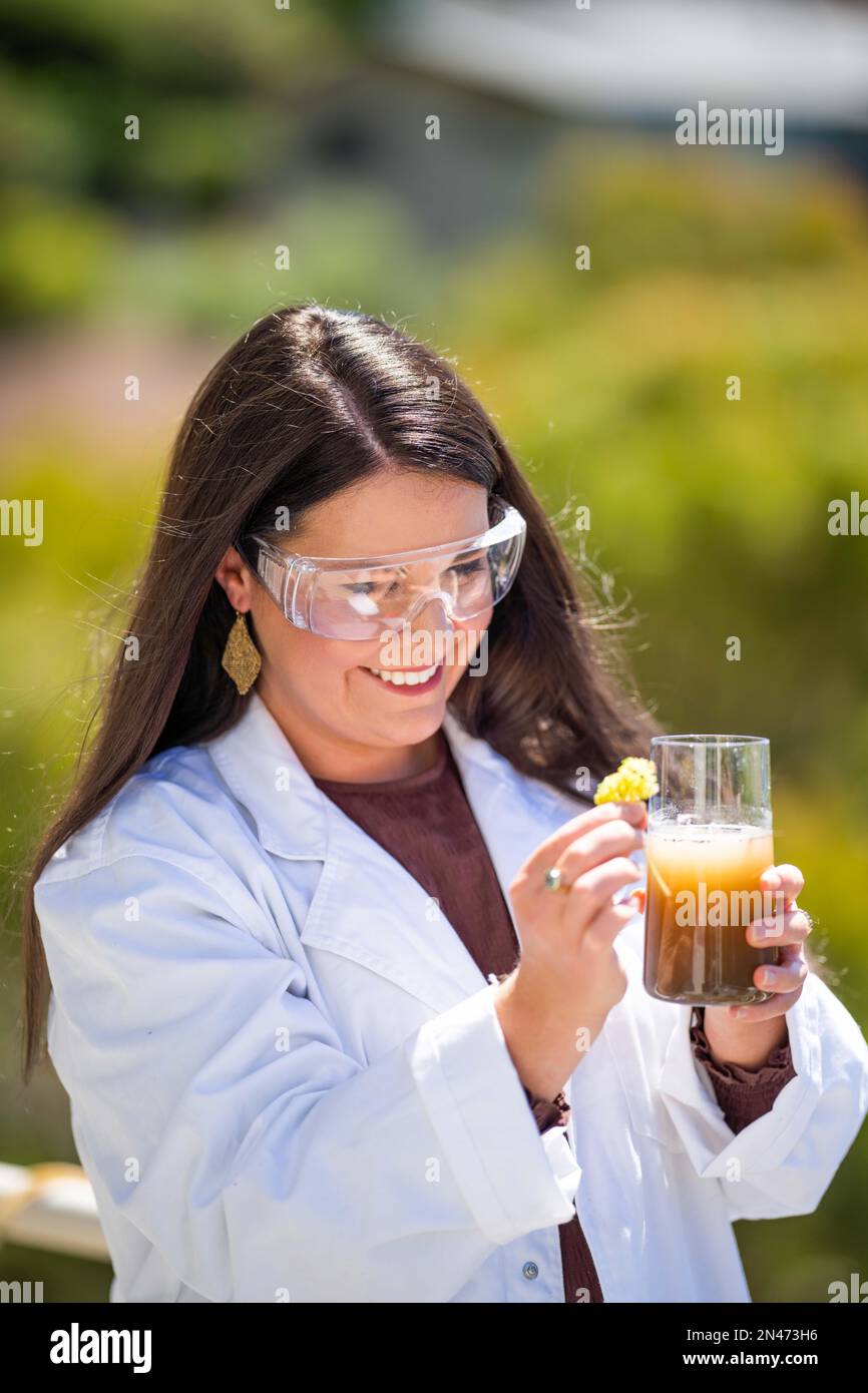 Soil test, female agricultural scientist conducting a soil test in a