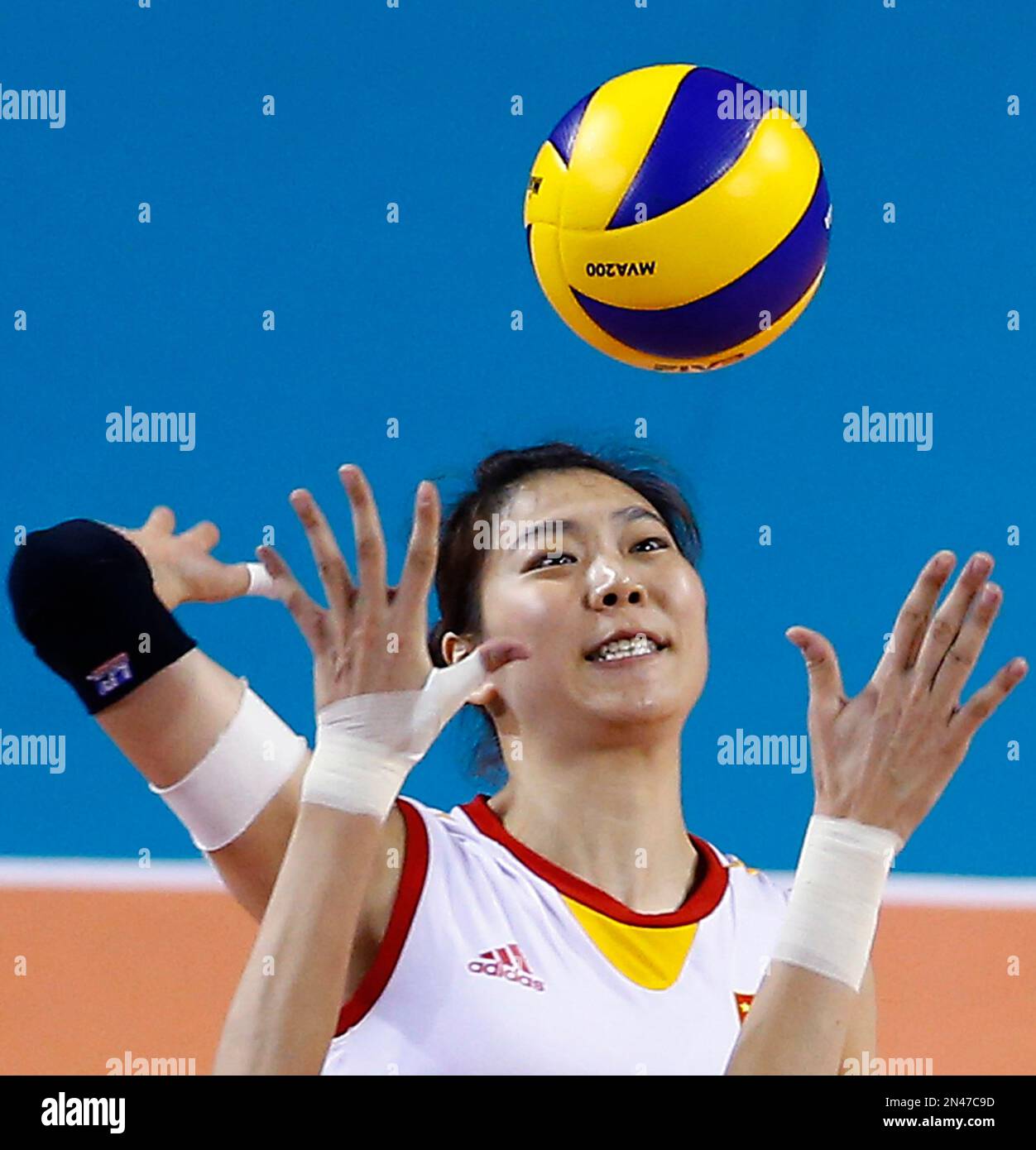 China's Yang Junjing spikes the ball against Russia during their Women ...