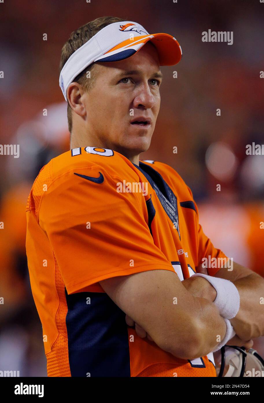 Denver Broncos quarterback Peyton Manning (18) watches from the ...