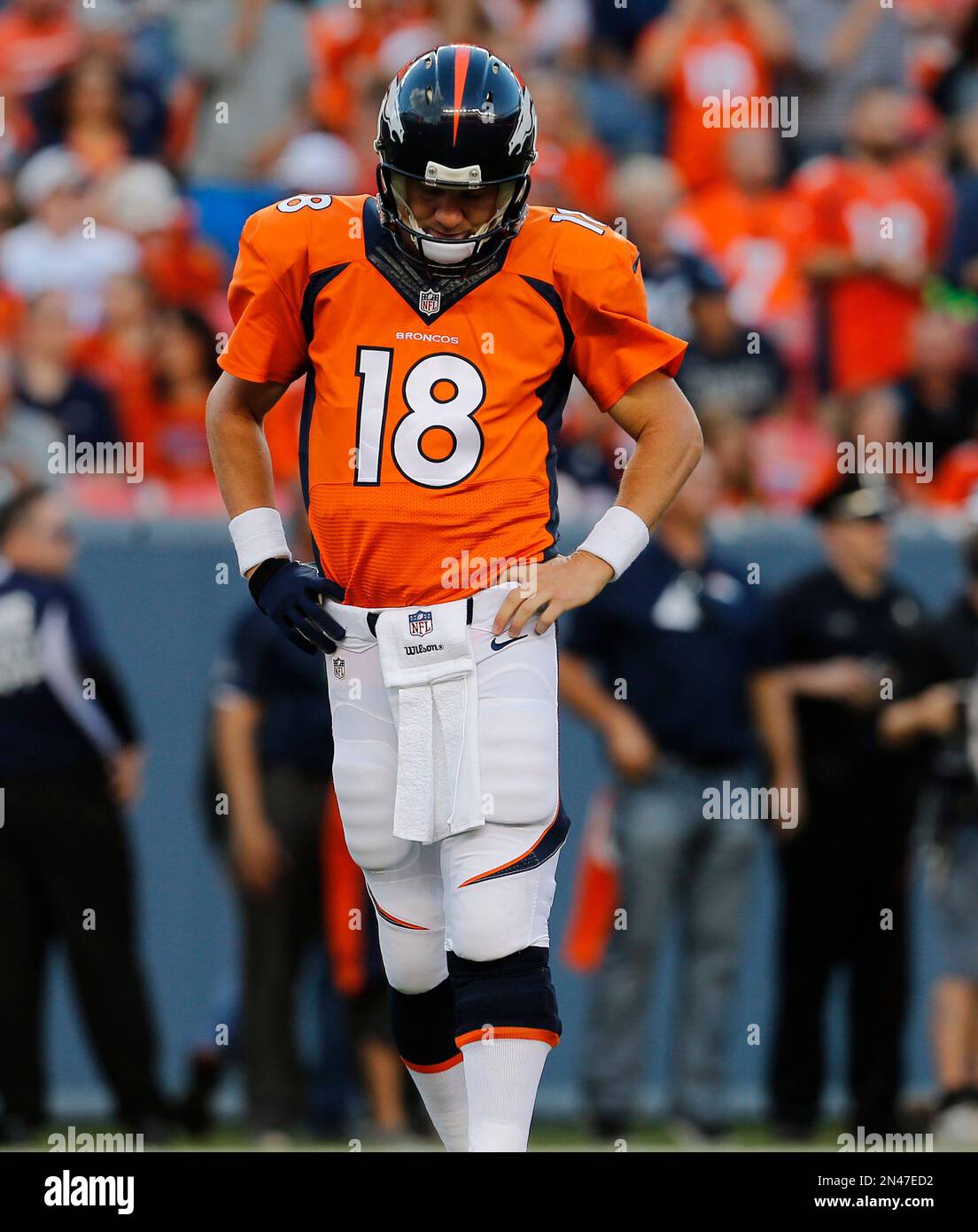 Denver Broncos quarterback Peyton Manning (18) looks away during an NFL ...