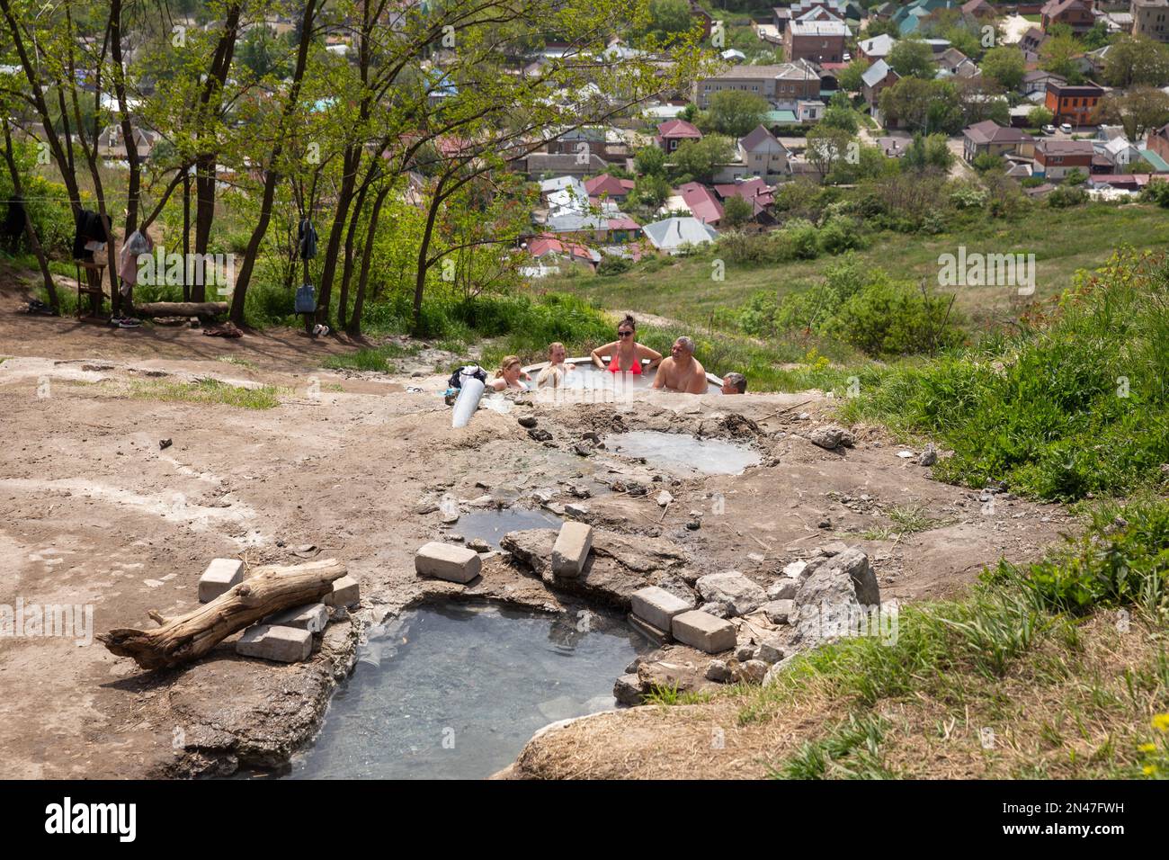 Pyatigorsk, Russia - May 10, 2022: People bathe in thermal mineral springs (folk baths) on the slope of Mount Mashuk in Pyatigorsk Stock Photo