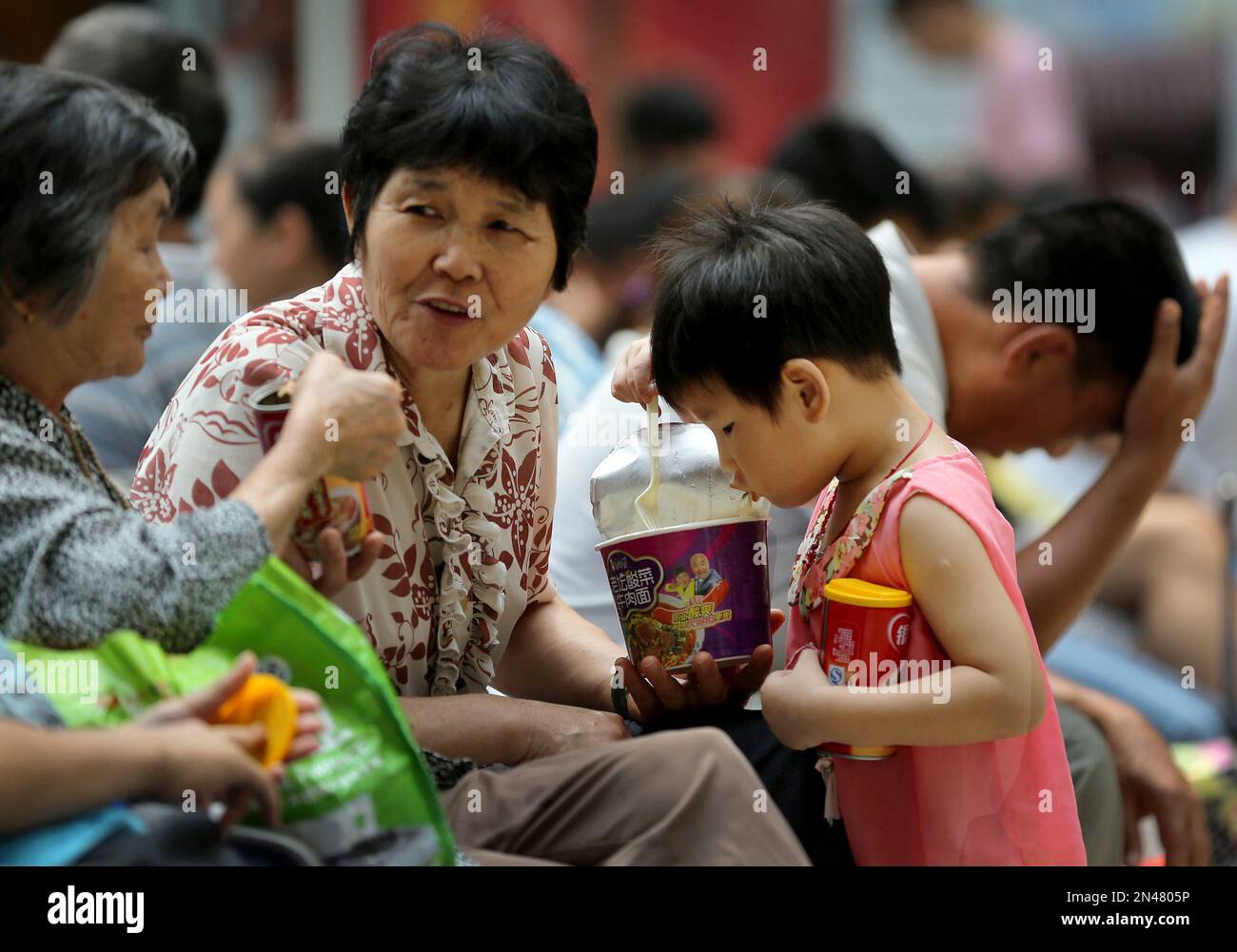 in-this-sunday-aug-17-2014-photo-a-child-eats-instant-noodle-at-a
