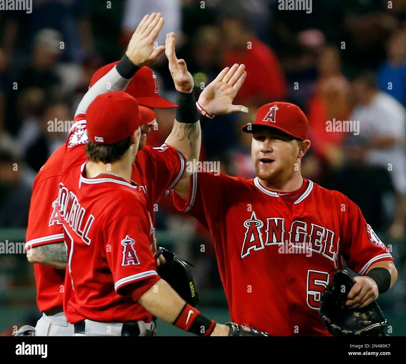Los Angeles Angels' Kole Calhoun, right, Collin Cowgill, front left
