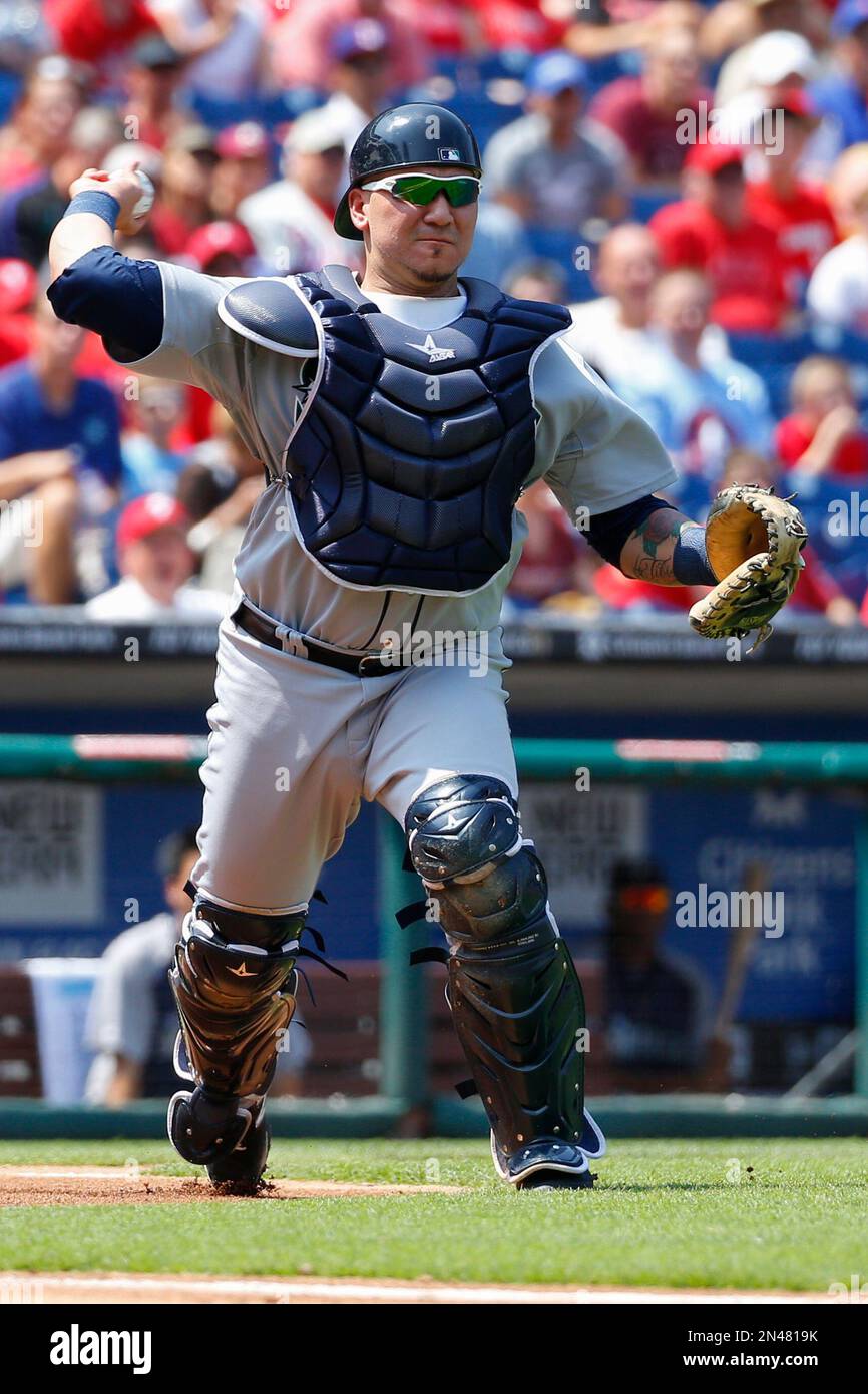 Seattle Mariners catcher Jesus Sucre throws the ball to first during